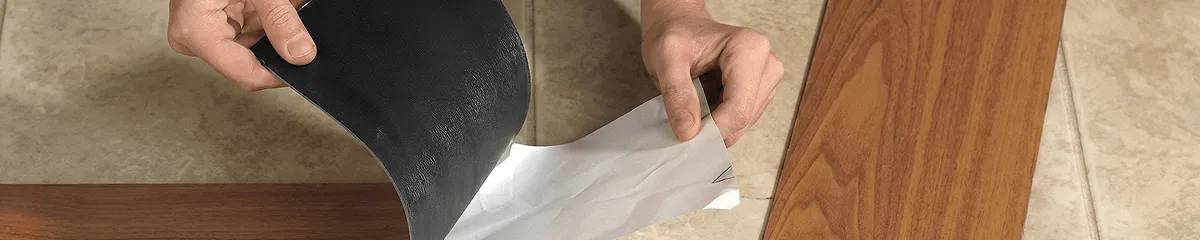 A professional installing vinyl flooring in Akron, OH